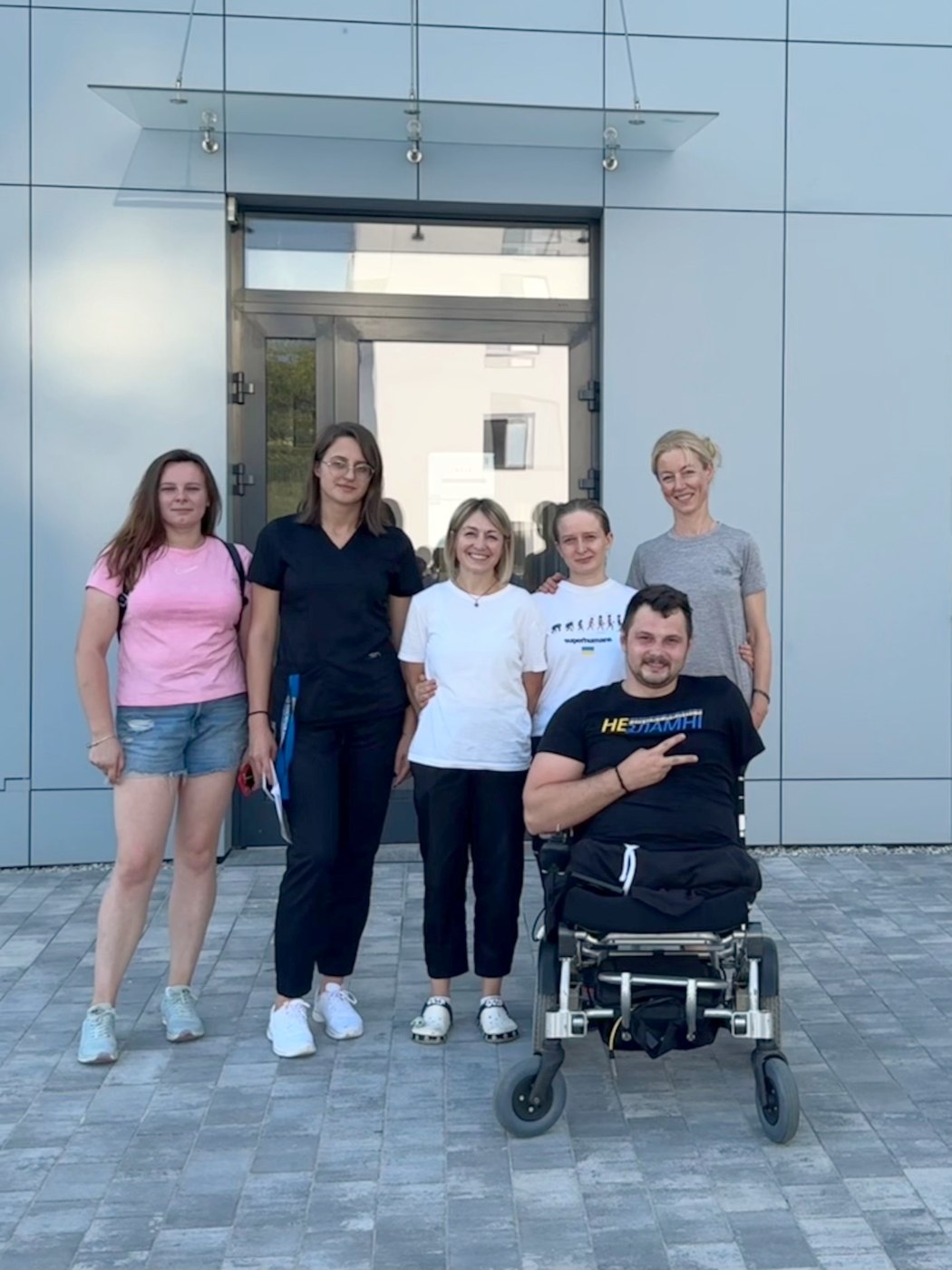 The team with a participant outside the rehabilitation centre